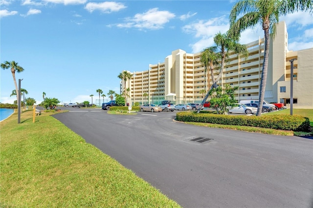 view of property with uncovered parking