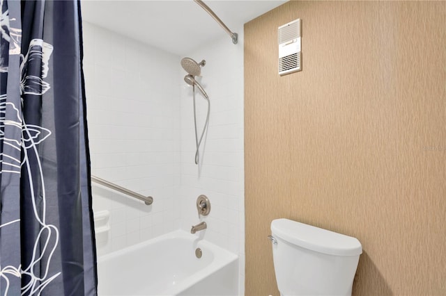 bathroom with toilet and shower / bath combo