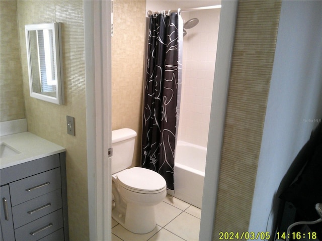 bathroom with tile patterned flooring, toilet, vanity, and shower / bath combo