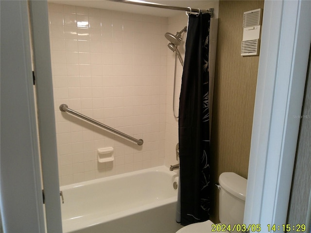 bathroom featuring visible vents, toilet, and shower / tub combo