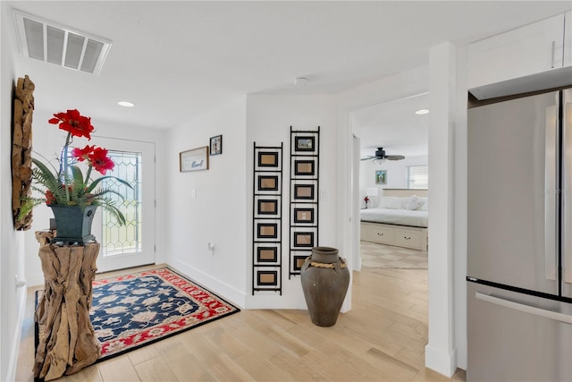 entrance foyer featuring visible vents, recessed lighting, light wood finished floors, baseboards, and ceiling fan