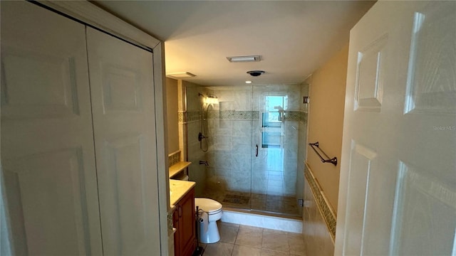 full bathroom with toilet, a stall shower, tile patterned flooring, and vanity