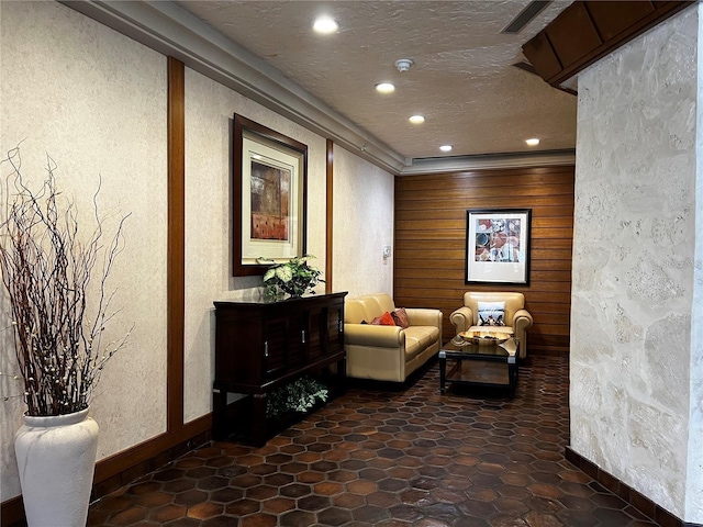 living area with a textured ceiling and recessed lighting