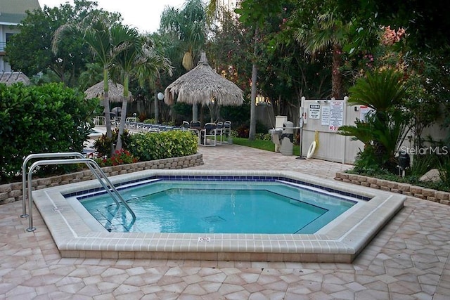 view of pool featuring a patio and fence