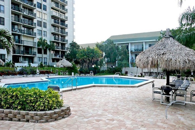 community pool with a patio area