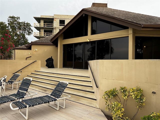 exterior space with a shingled roof