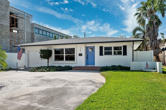 single story home with a front lawn and a garage