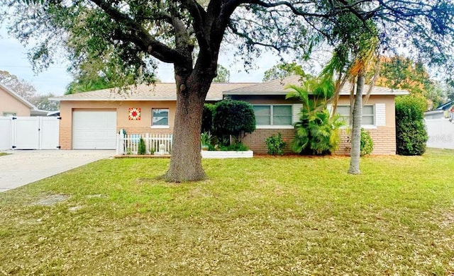 6315 25th Ave N, Saint Petersburg, FL 33710 - ranch-style house featuring driveway, an attached garage, a front lawn, and brick siding