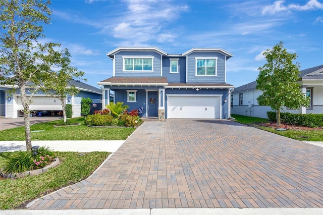 view of front facade with a front lawn and a garage