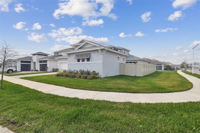 view of side of home with a lawn