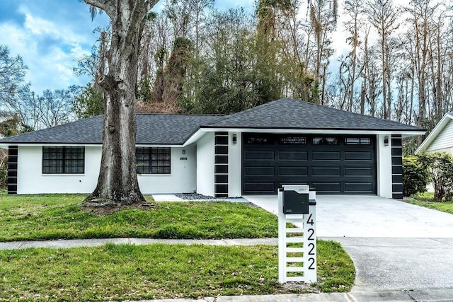 ranch-style house featuring stucco siding, a shingled roof, a garage, driveway, and a front lawn