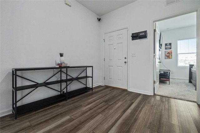 unfurnished bedroom with dark wood-style floors and baseboards