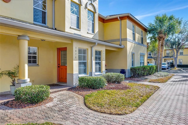 doorway to property with stucco siding