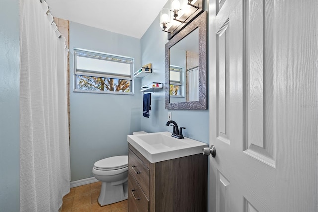 bathroom featuring tile patterned flooring, a shower with shower curtain, toilet, and vanity