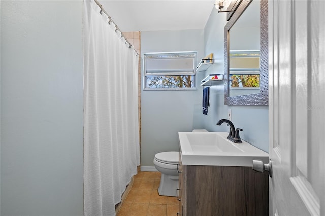 bathroom with tile patterned flooring, a shower with shower curtain, toilet, and vanity