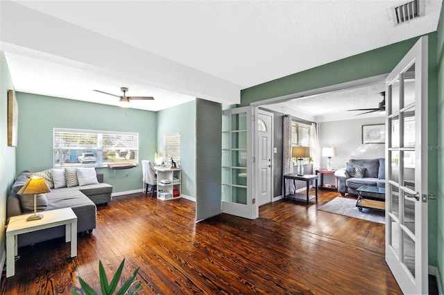 living area with hardwood / wood-style floors, french doors, baseboards, and ceiling fan