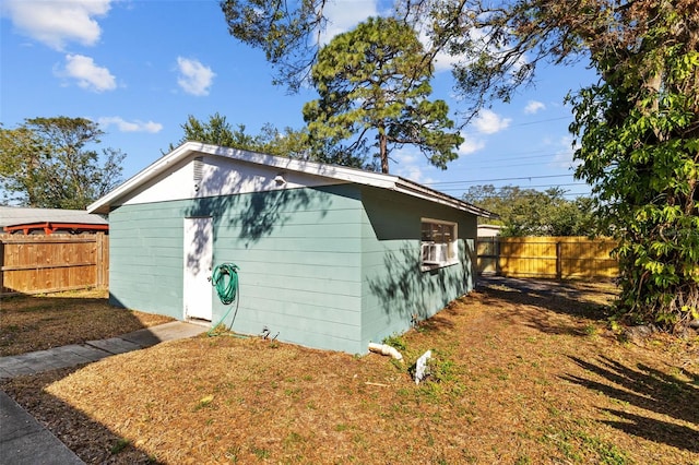 view of outbuilding featuring a fenced backyard