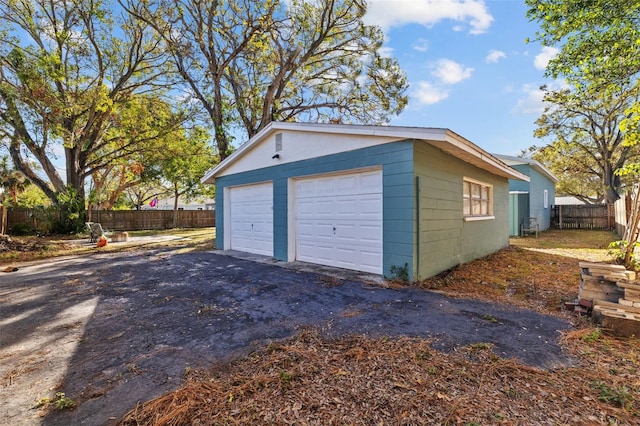 detached garage with fence