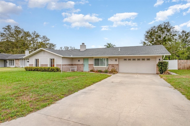 ranch-style house featuring a garage, driveway, a front lawn, and fence