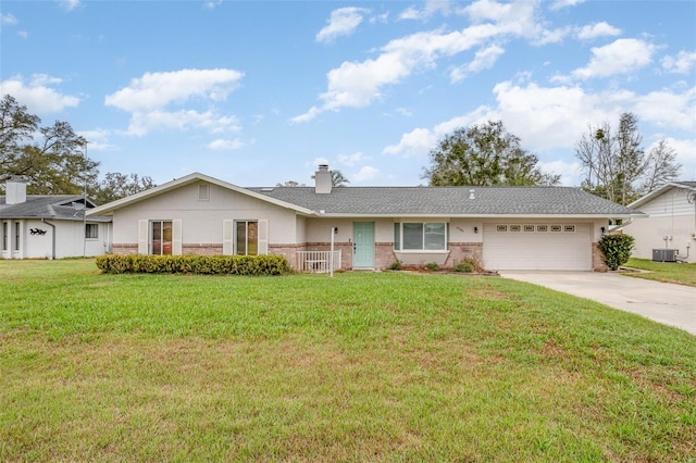 ranch-style house featuring central AC, a front lawn, concrete driveway, and brick siding