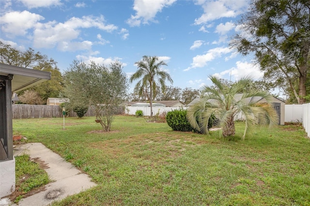 view of yard with a fenced backyard