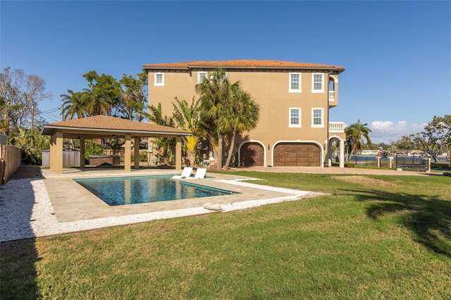 view of pool with a lawn, a patio area, and a gazebo