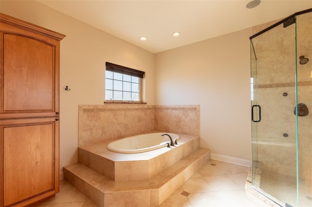 bathroom featuring tile patterned flooring and independent shower and bath