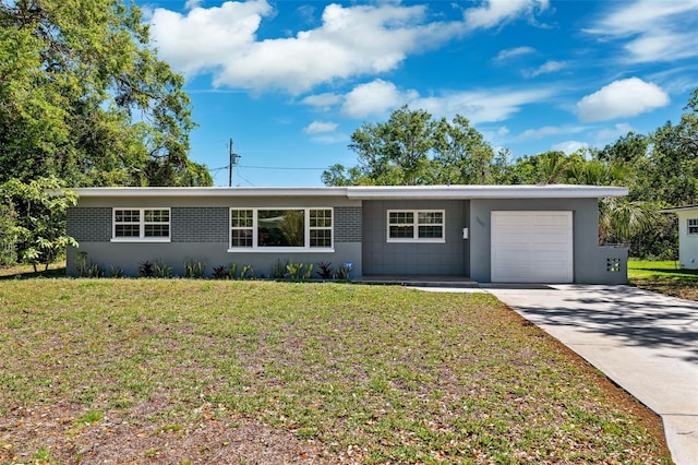 1119 77th St N, Saint Petersburg, FL 33710 - ranch-style home featuring a front yard, an attached garage, driveway, and stucco siding