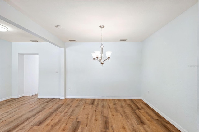 1119 77th St N, Saint Petersburg, FL 33710 - unfurnished room with a chandelier, visible vents, and baseboards