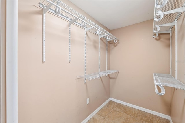 1119 77th St N, Saint Petersburg, FL 33710 - walk in closet with tile patterned flooring