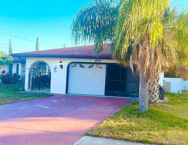 garage featuring a yard