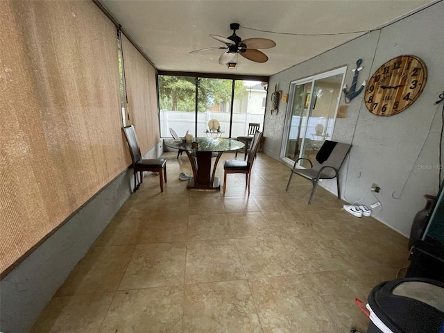 sunroom / solarium with ceiling fan