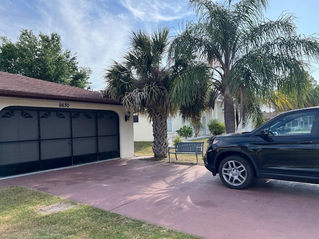 8630 Winter Haven Dr, Hudson, FL 34667 - garage with concrete driveway