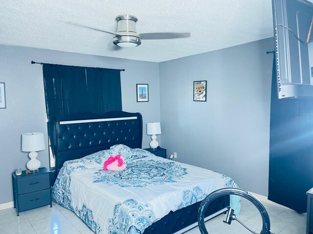 8630 Winter Haven Dr, Hudson, FL 34667 - bedroom featuring a textured ceiling and ceiling fan