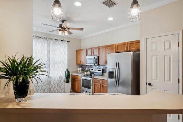 kitchen featuring visible vents, ornamental molding, backsplash, appliances with stainless steel finishes, and brown cabinetry