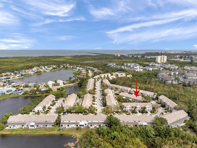 aerial view with a water view and a residential view