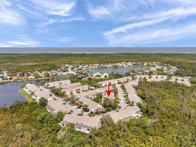 birds eye view of property with a residential view and a water view