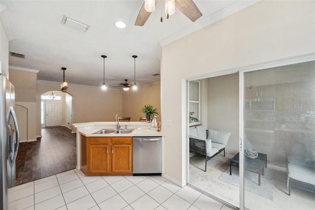 kitchen featuring a ceiling fan, visible vents, appliances with stainless steel finishes, and a sink