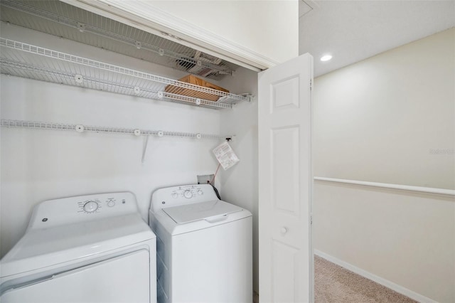 washroom featuring laundry area, baseboards, independent washer and dryer, and carpet floors