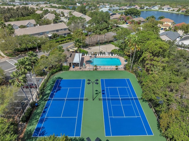 birds eye view of property featuring a residential view and a water view