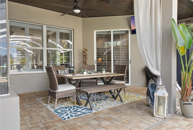 view of patio featuring a ceiling fan and outdoor dining space