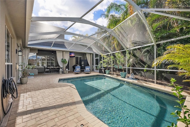 outdoor pool featuring a lanai and a patio