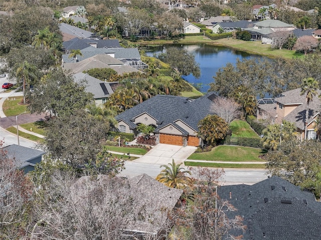 bird's eye view with a water view and a residential view