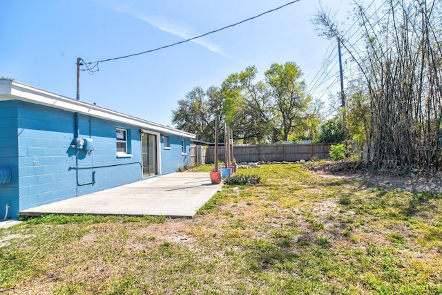 view of yard featuring a patio area and fence