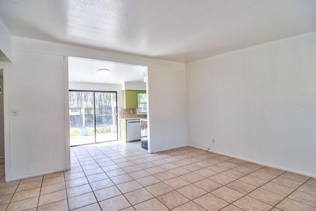 unfurnished room with light tile patterned floors