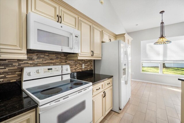 kitchen featuring white appliances, cream cabinets, decorative backsplash, and pendant lighting