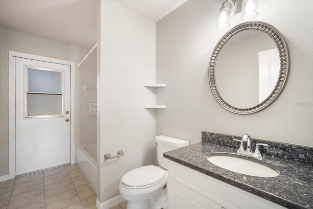 full bath featuring toilet, bathing tub / shower combination, vanity, and tile patterned floors