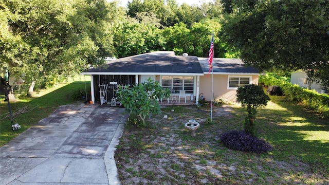 single story home with a carport and a front yard