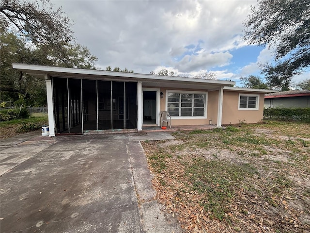 view of front of property featuring a sunroom