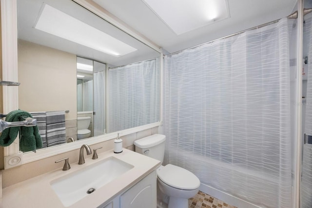 full bath with toilet, shower / bath combination with curtain, and vanity